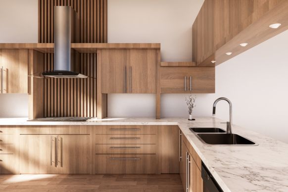 Sunlit modern kitchen with wood cabinets, marble countertops, double stainless sink, and stainless range hood
