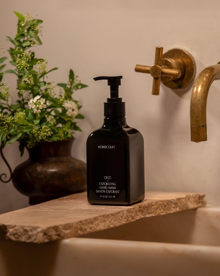 black bottle exfoliating hand wash on a sink