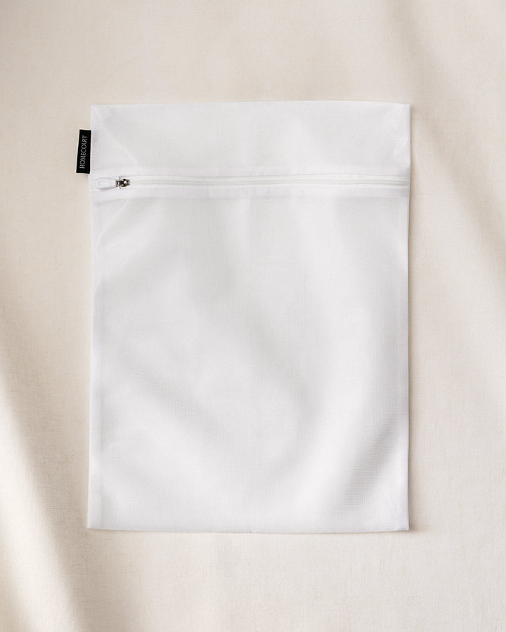 Laundry delicates bag with zipper, designed to protect fragile clothing during machine washing.