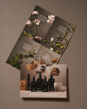 Non toxic home fragrance collection with candles, sprays, and soaps displayed alongside botanical scent inspiration cards