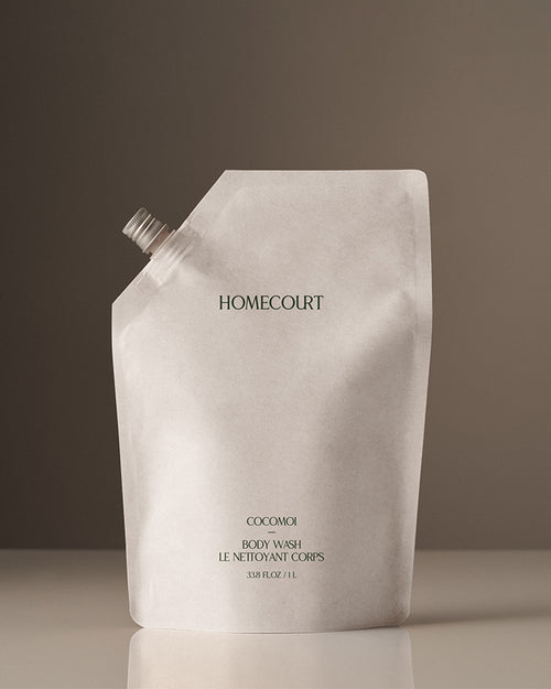 white body wash refill pouch with green text