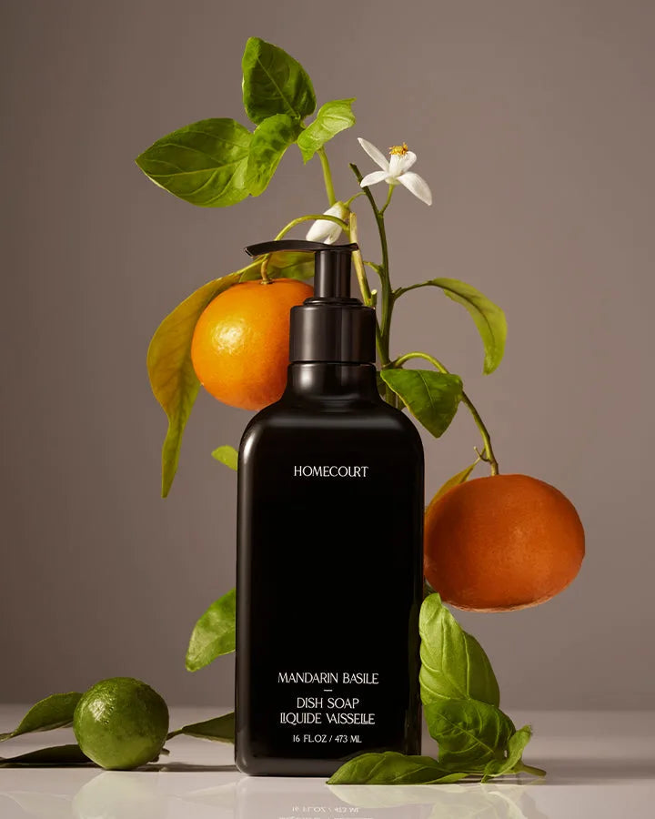 Homecourt Mandarin Basile Dish Soap beside mandarins and basil