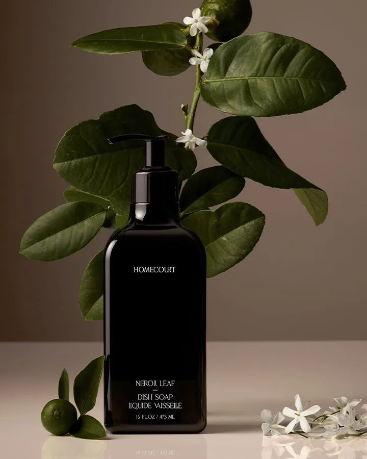 Homecourt Neroli Leaf Dish Soap among citrus leaves and limes