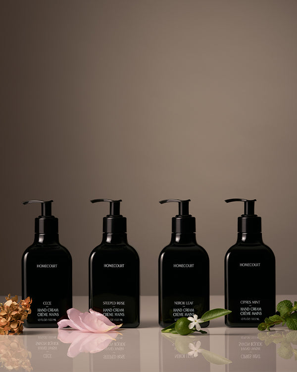 Luxury hand wash and lotion set featuring Cece, Steeped Rose, Neroli Leaf, and Cipres Mint scents with matching floral accents.